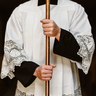 Altar Server holding Cross